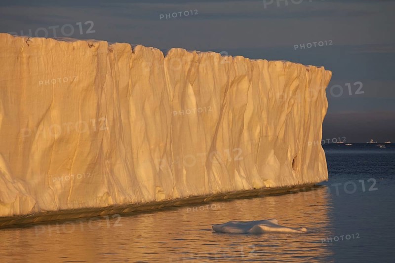 Coastal glacier terminus at sunset