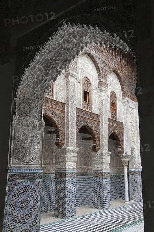 Madrasah courtyard with archway in city