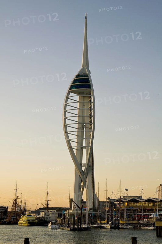 View of harbour and waterfront with Spinnaker Tower in evening light
