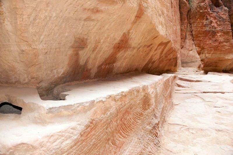 Restored ancient water conduit in Siq