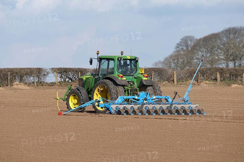 John Deere tractor with seed drill