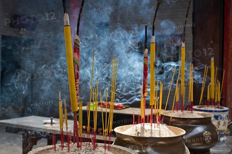 Incense sticks burning on incense pot