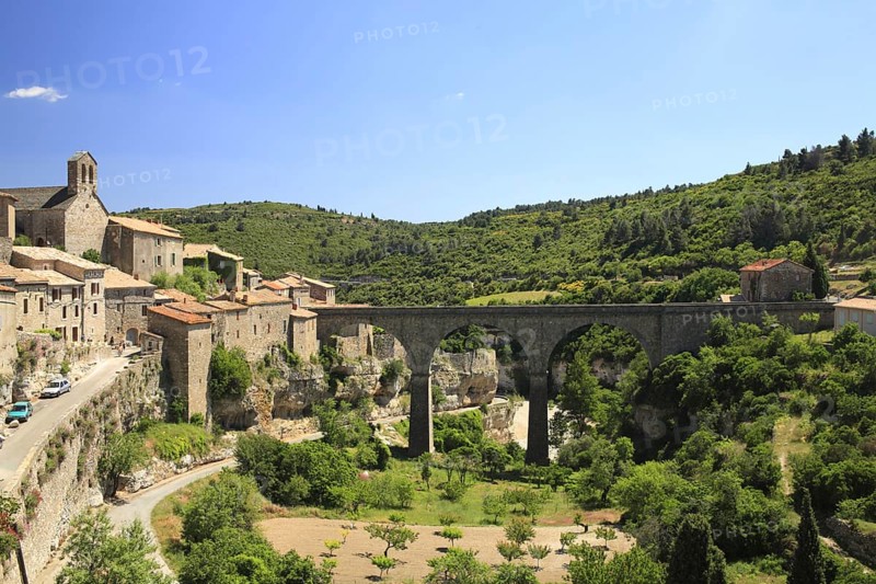 View of historic town with bridge over river valley