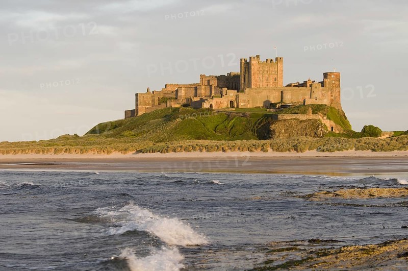 View across beach and sea towards castle