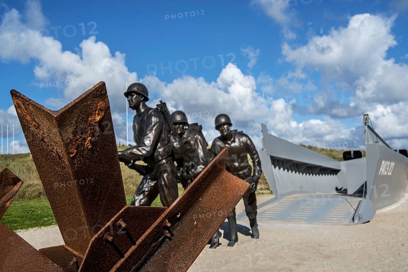 Czech hedgehog and landing craft in front of the Musee du Debarquement Utah Beach