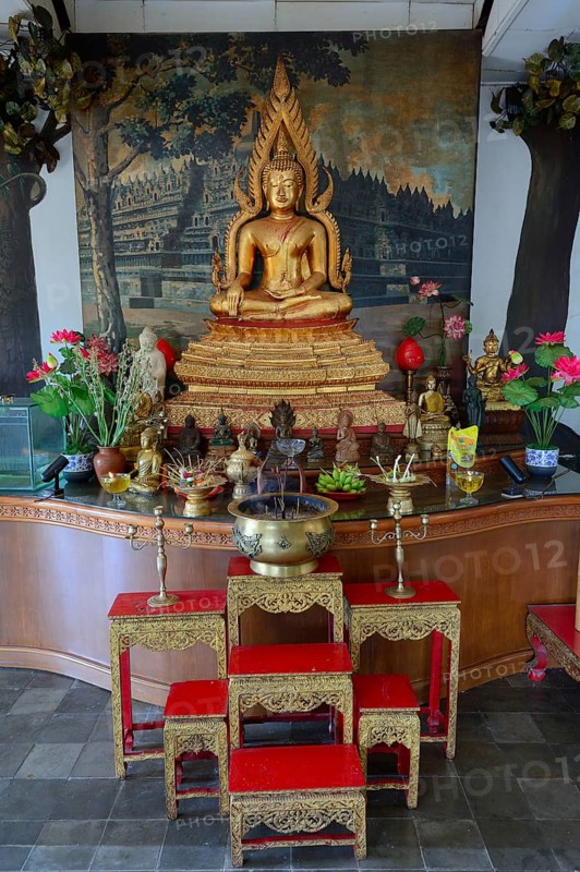 Buddha statue on an altar in a prayer room of the Buddhist monastery Brahma Vihara