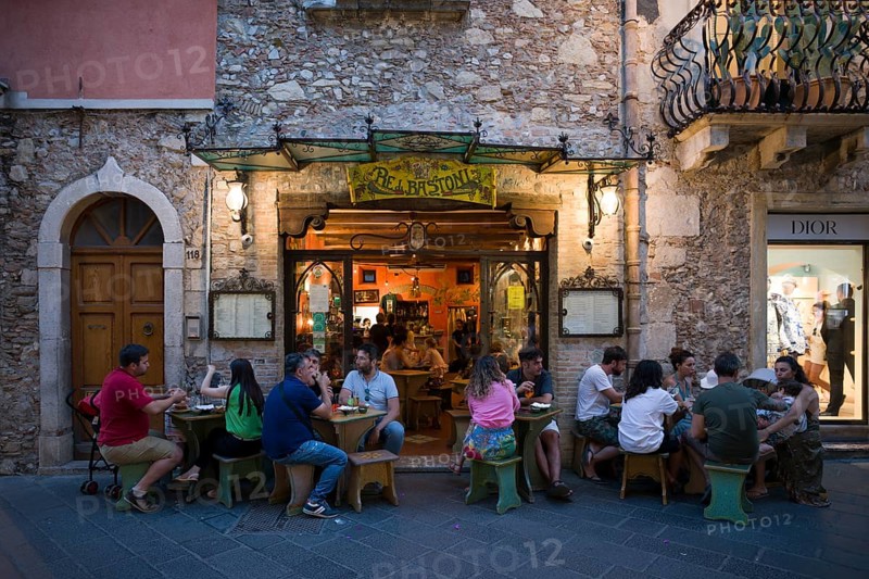 People sitting in front of restaurant