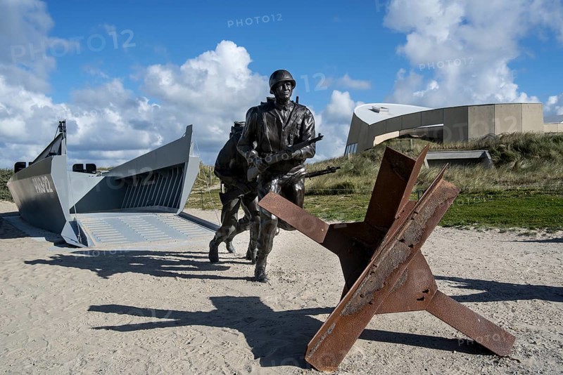 Czech hedgehog and landing craft in front of the Musee du Debarquement Utah Beach