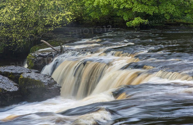 View of river and waterfall
