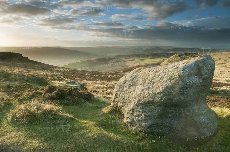 View from Gritstone rocks onto moorland habitat in the evening sun
