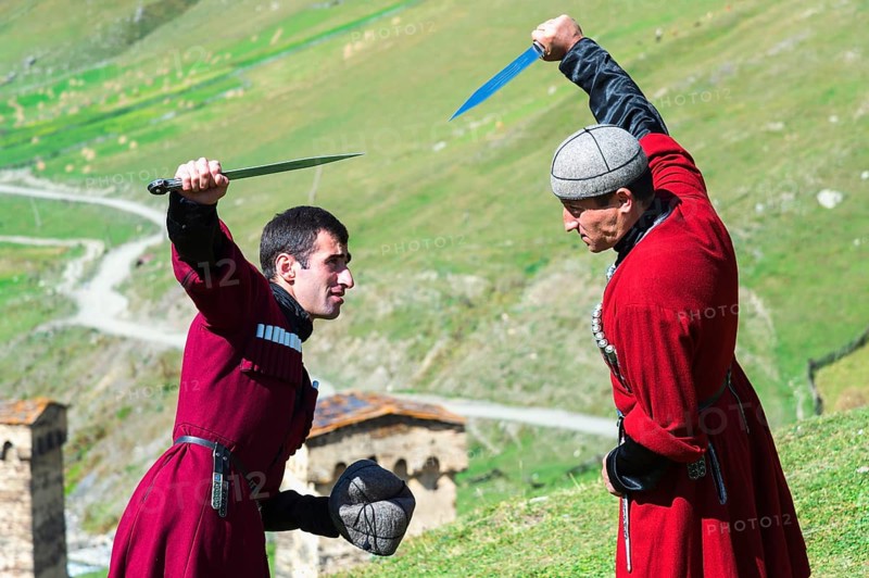 Dagger fighting demonstration by two Georgian men of a folklore group