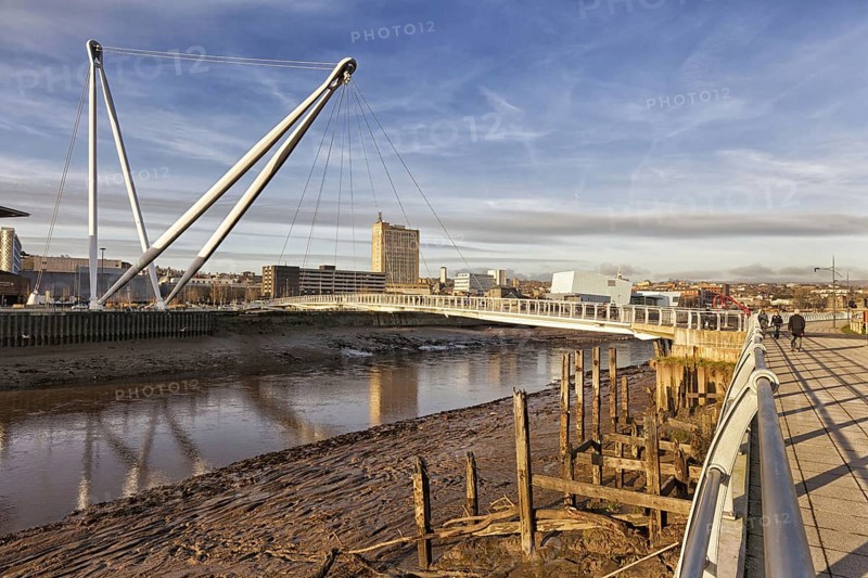 View of tidal river and footbridge