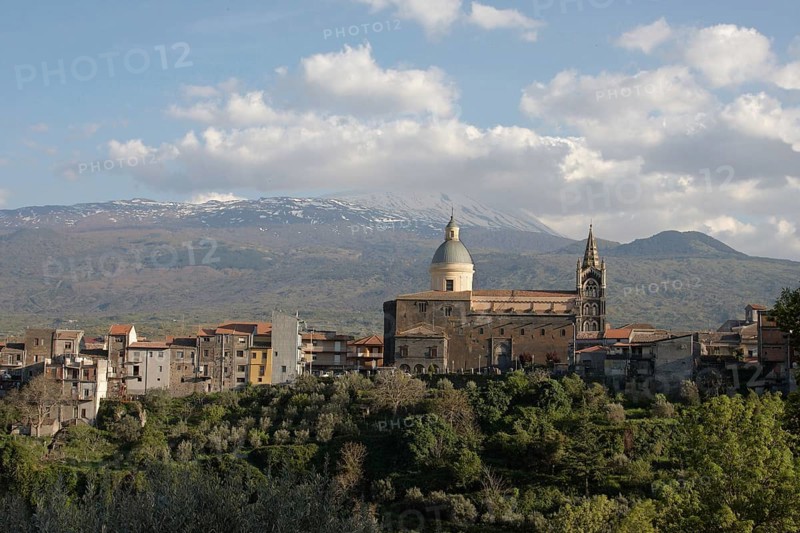 View of a village with volcano in the background