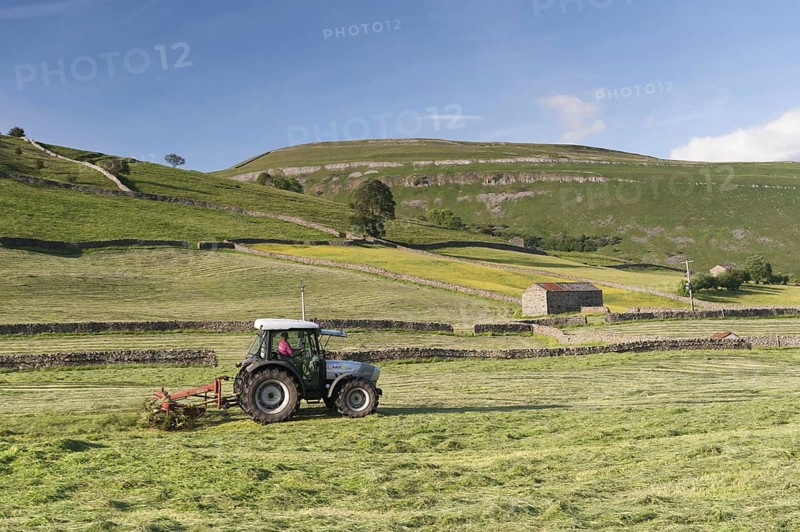 Hurlimann tractor with tedder