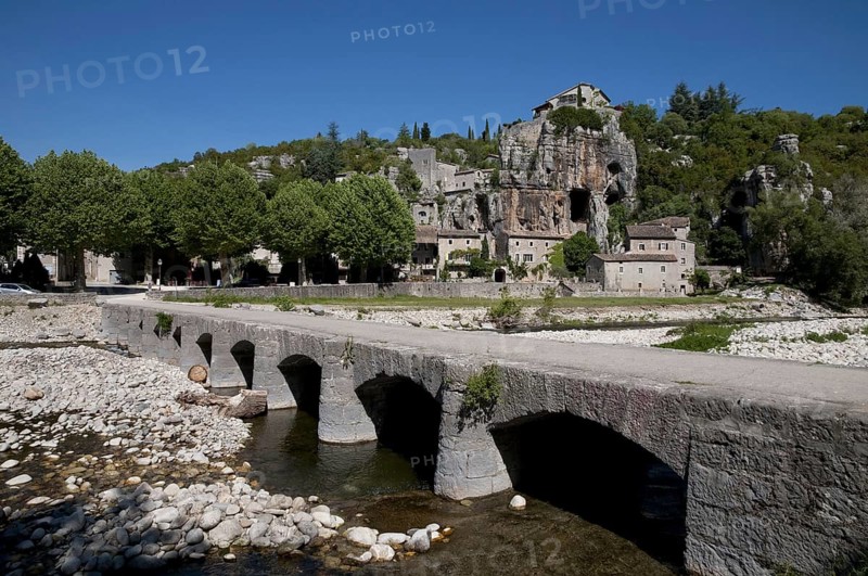 View of the bridge over the river and the village