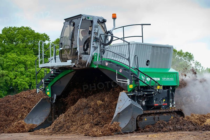 Komptech self-propelled compost turner turning rotting bedding manure
