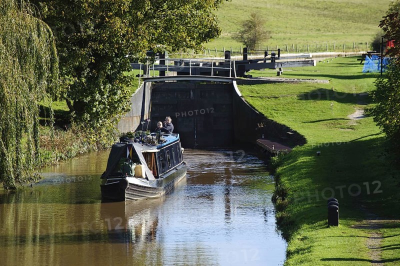 Narrow boat leaving canal lock