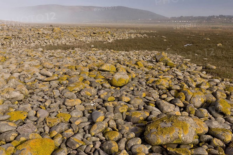 View of shingle bank spreading inland as sea levels rise