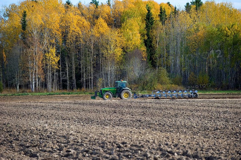 John Deere tractor with eight furrow reversible plough