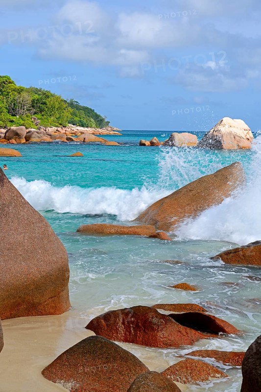 Beach and rocks of Anse Lazio in the evening