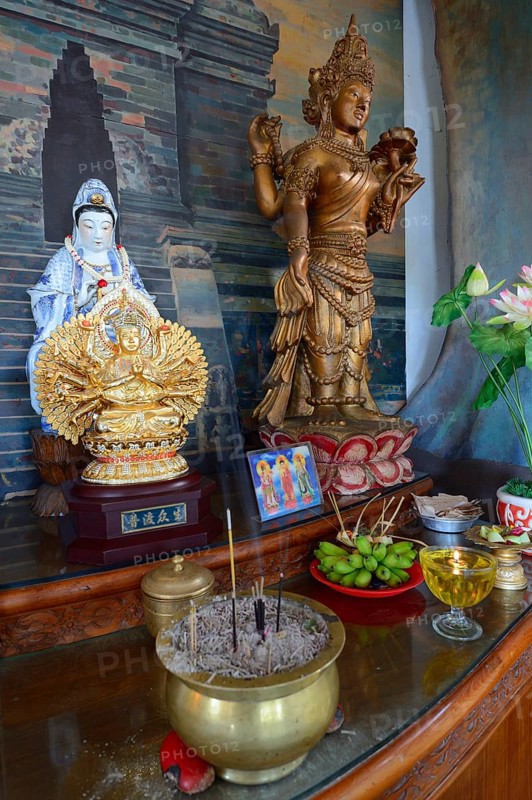Buddha statue on an altar in a prayer room of the Buddhist monastery Brahma Vihara