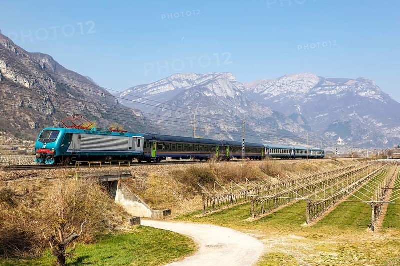 Trenitalia EuroCity train on the Brenner railway near Avio in Italy