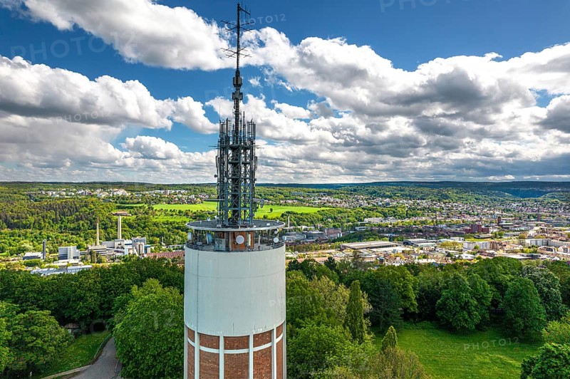 Aerial view of the water tower and green city in the background