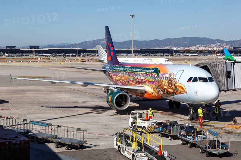 A Brussels Airlines Airbus A320 with registration OO-SNF in the Tomorrowland special livery at Barcelona Airport