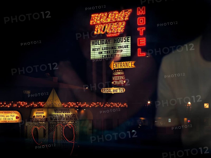View from bus of neon lights and two hearts