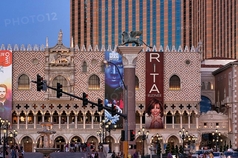 Replica St. Mark's Square Piazza San Marco with advertising banners for events and tourists at dusk