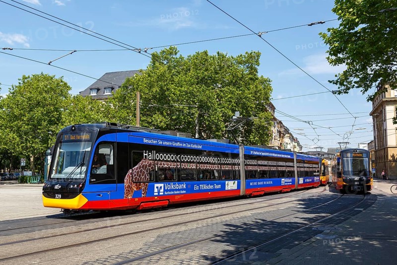 AVG Tram type Stadler CityLink local tram with advertising at the main station stop in Karlsruhe