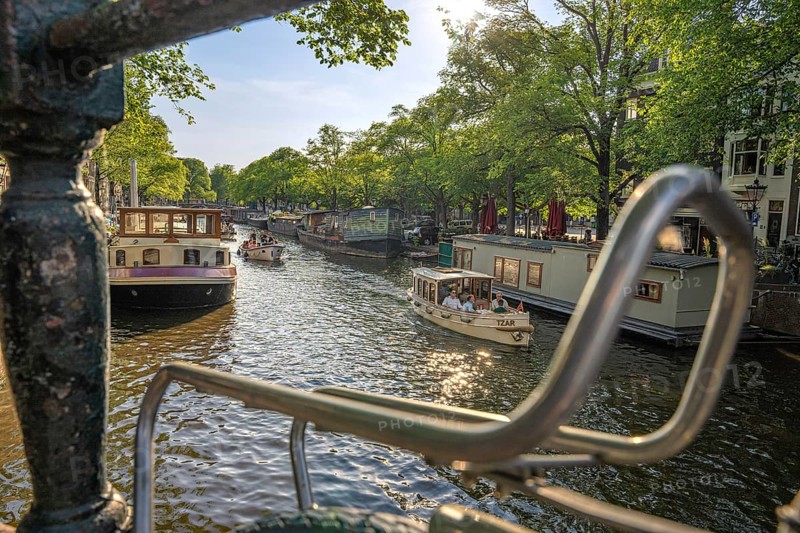 Over a bicycle carrier on the canal to a tourist boat