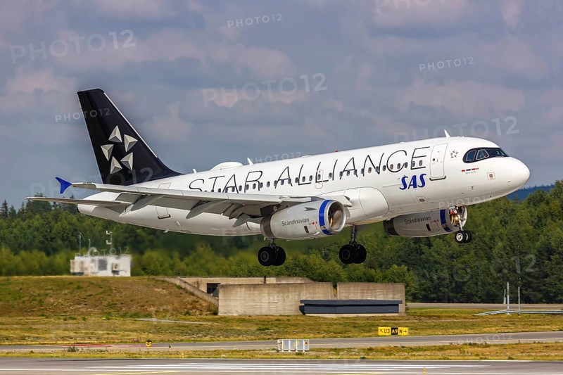 An SAS Scandinavian Airlines Airbus A319 aircraft with registration number OY-KBP and Star Alliance special livery at Oslo Gardermoen Airport