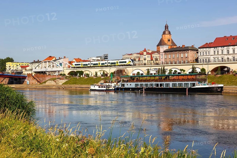 Landsberg an der Warthe town on the river with a Newag Impuls 2 regional train in Gorzow Wielkopolski