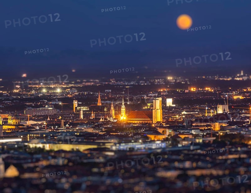 Night aerial view of Munich from Olympiaturm Olympic Tower with tilt shift toy effect shallow depth of field. Munich