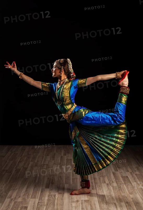Young beautiful woman dancer exponent of Indian classical dance Bharatanatyam