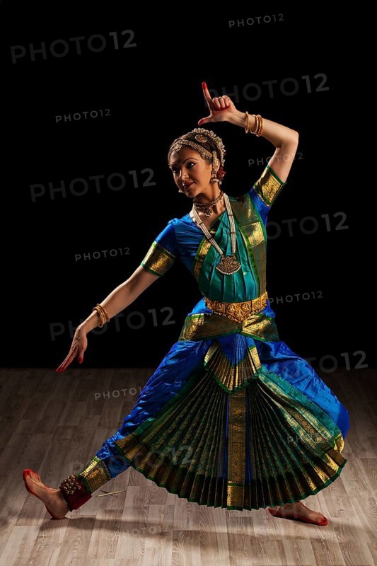 Young beautiful woman dancer exponent of Indian classical dance Bharatanatyam