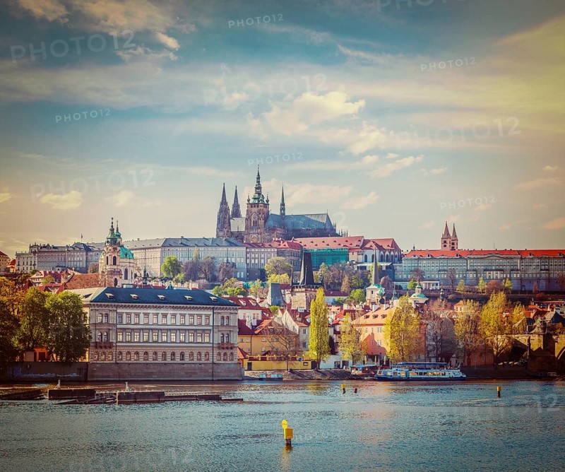 Vintage retro hipster style travel image of Charles bridge over Vltava river and Gradchany