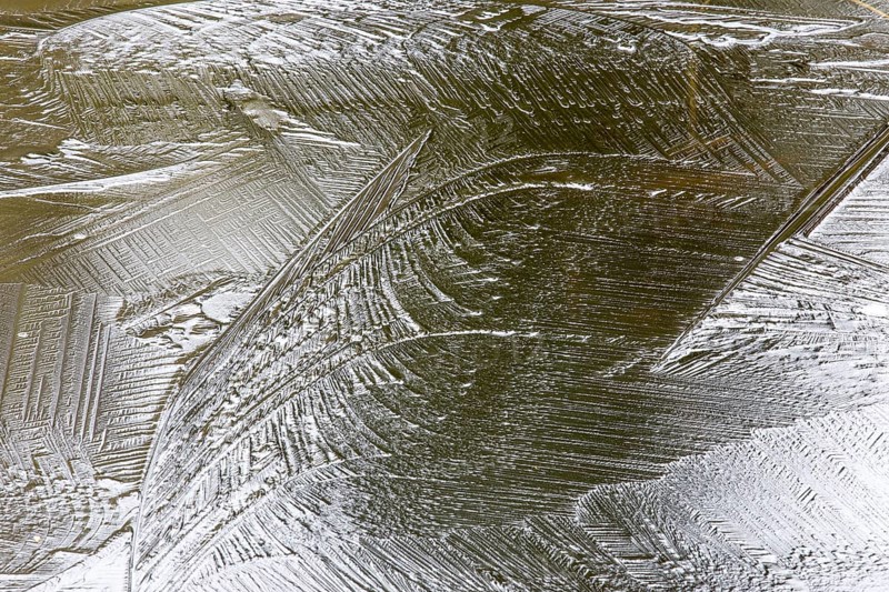 Creative photo. Patterns on a frozen lake