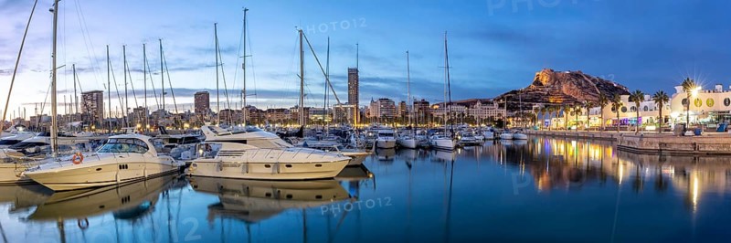 Port of Alicante at night Port dAlacant Marina with boats and view of Castillo Castle holiday travel city panorama in Alicante