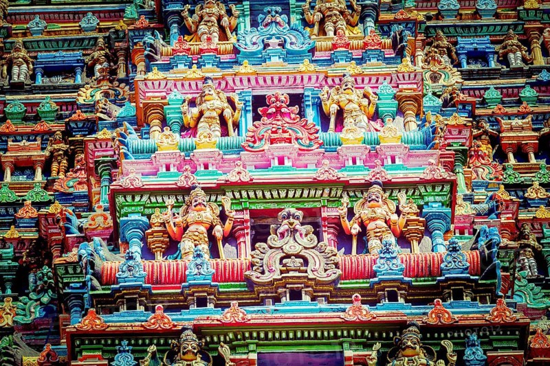 Vintage retro hipster style travel image of Sculptures on Hindu temple gopura
