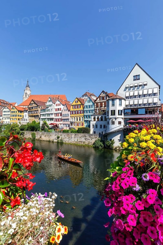 City on the Neckar River with punting boat in Tuebingen