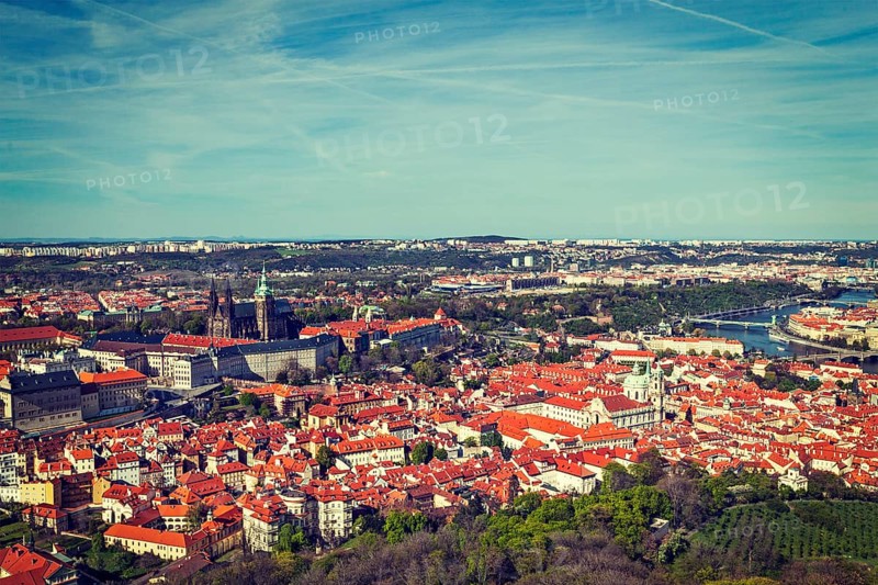 Vintage retro hipster style travel image of aerial view of Hradchany part of Prague the Saint Vitus St. Vitt's Cathedral and Prague Castle