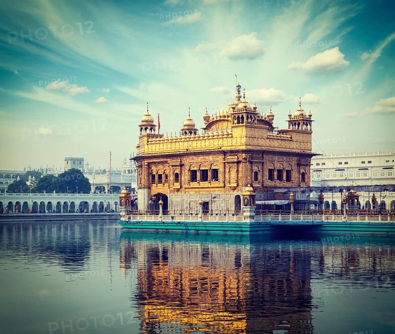 Vintage retro hipster style travel image of Sikh gurdwara Golden Temple