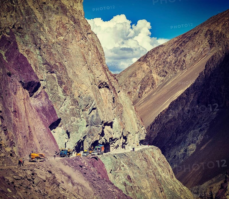 Vintage retro effect filtered hipster style travel image of Road construction in Himalayas. Ladakh
