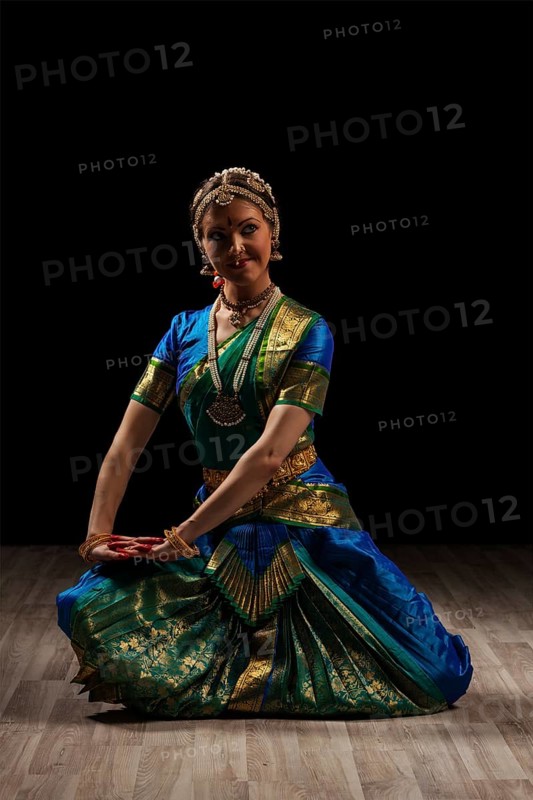 Young beautiful woman dancer exponent of Indian classical dance Bharatanatyam