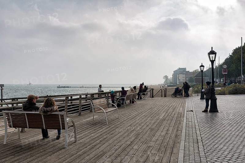 Pedestrians sitting on benches