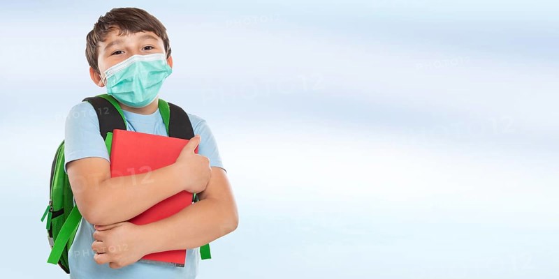 Young Pupil Child Boy with Mask against Corona Virus with Text Free Space Copyspace in Stuttgart
