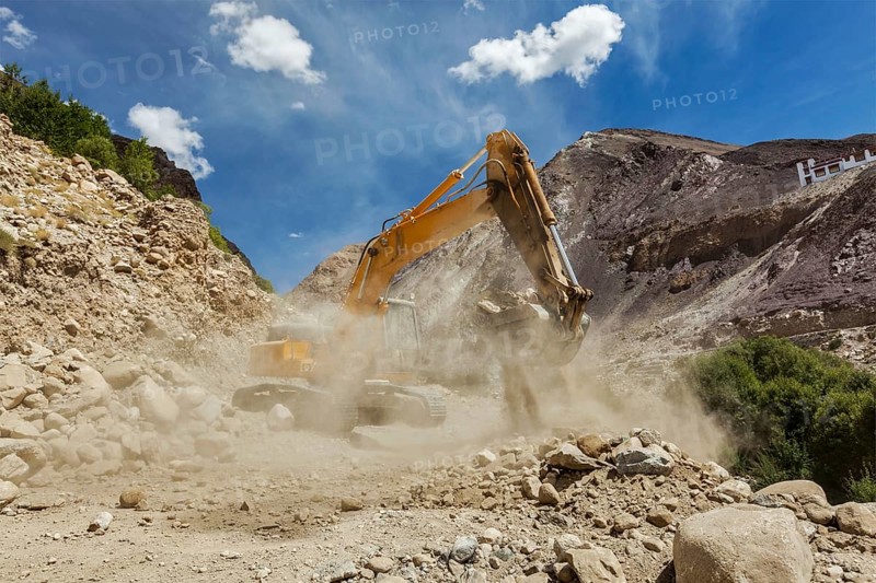 Excavator doing road construction in Himalayas. Ladakh