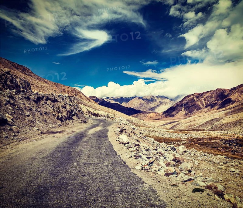 Vintage retro effect filtered hipster style travel image of Scenic road in Himalayas near Khardung-La pass. Ladakh